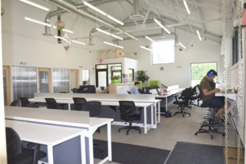 a room filled with furniture and a large window