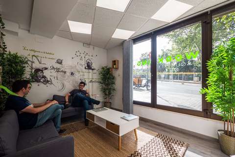 a group of people sitting around a living room