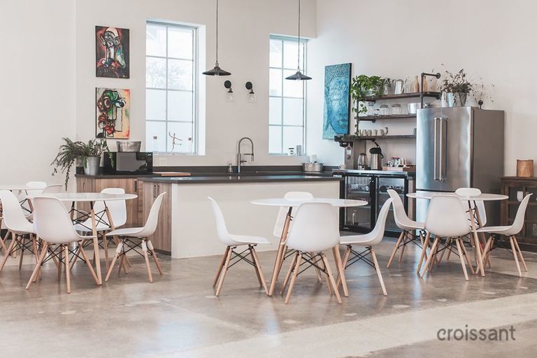 a room filled with furniture and a table