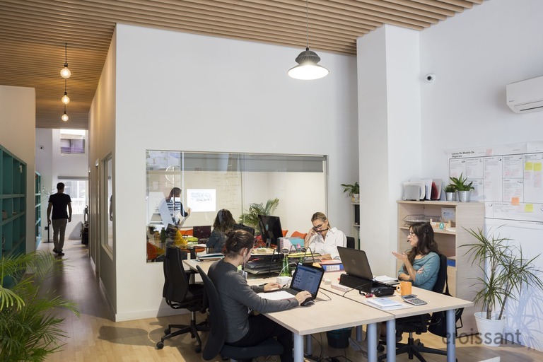 a group of people sitting at a table in a room