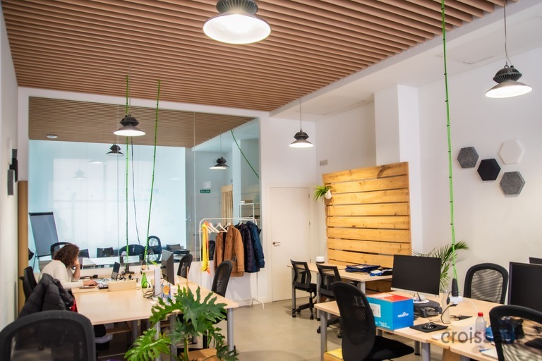 a living room filled with furniture and a tv