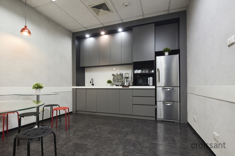 a kitchen with a table in a room