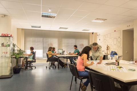 a group of people sitting at a table in a room