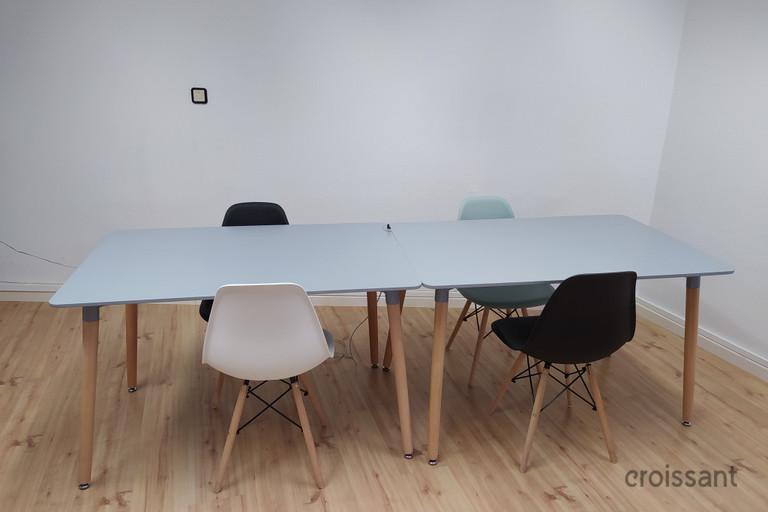 a desk with a chair in a room