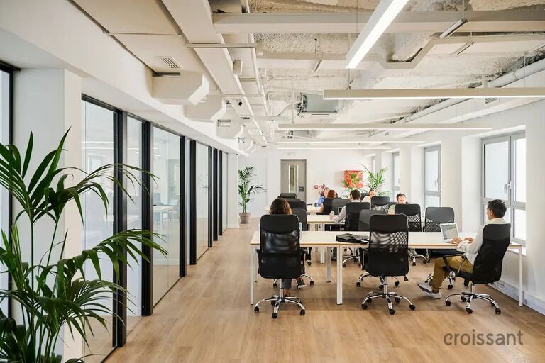 a room filled with furniture and a large window