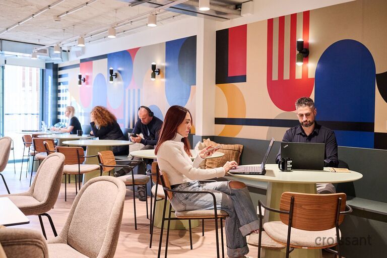 a person sitting at a table in a room