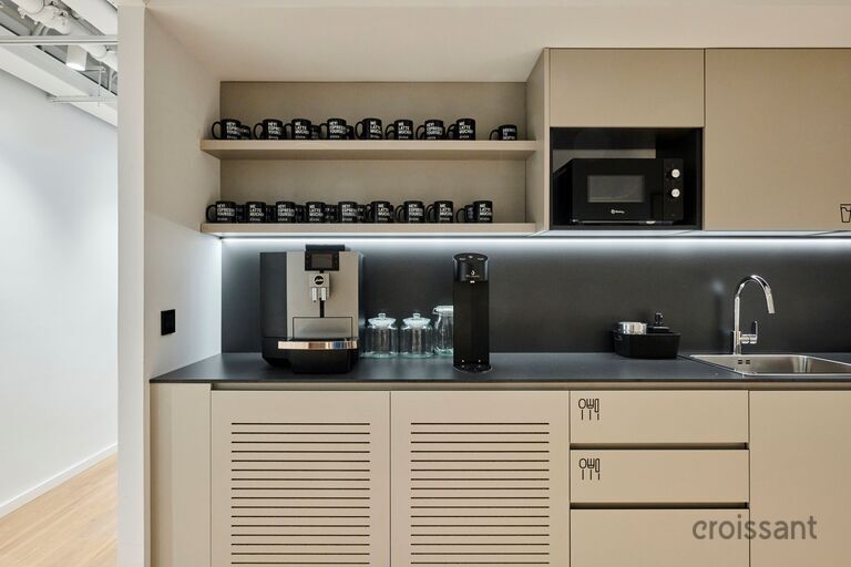 a kitchen with a sink and a microwave