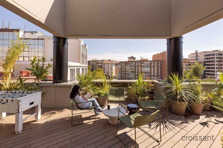 a chair sitting in front of a building