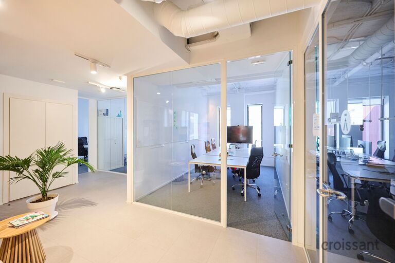 a room filled with furniture and a large window