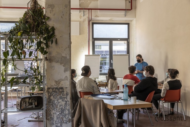 a group of people sitting at a table