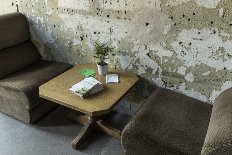 a chair sitting in front of a building