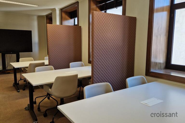 a room filled with furniture and a large window