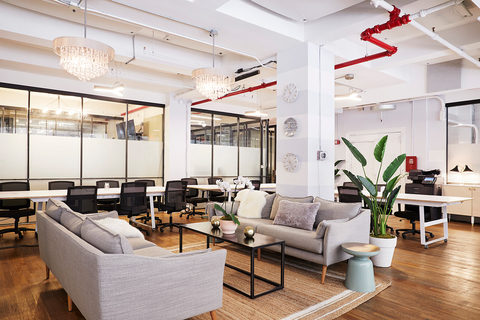a living room filled with furniture and a large window