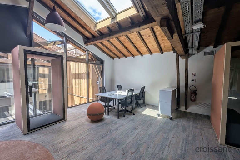a motorcycle parked on the side of a building