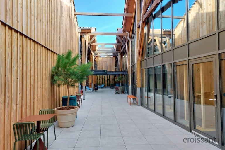 a train sitting on the side of a building