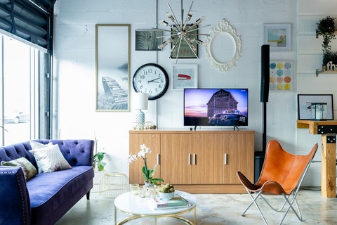 a living room filled with furniture and a fire place