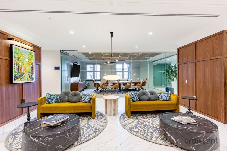 a room filled with furniture and a large window