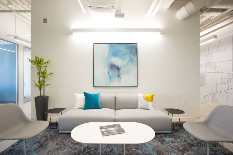 a living room filled with furniture and a flat screen tv