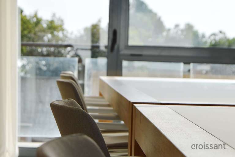a chair sitting in front of a window