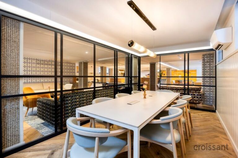 a dining room table in front of a window