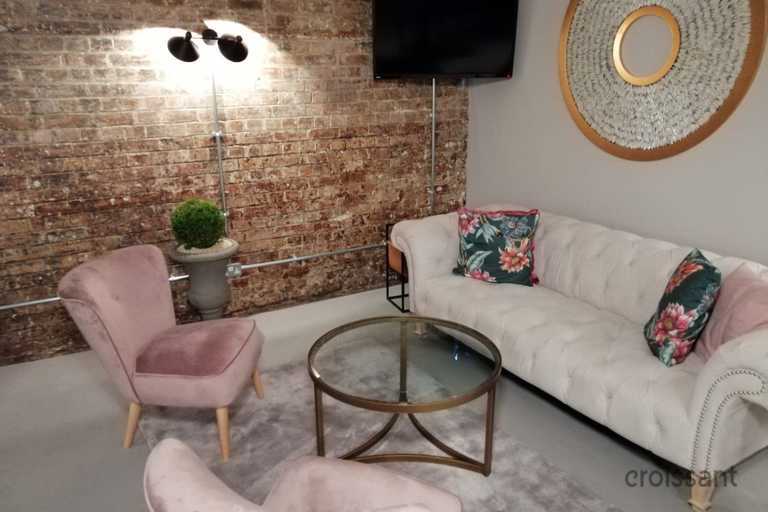 a living room filled with furniture and a fireplace