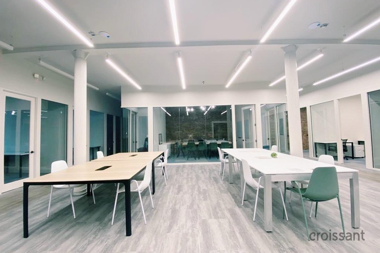 a room filled with furniture and a large window