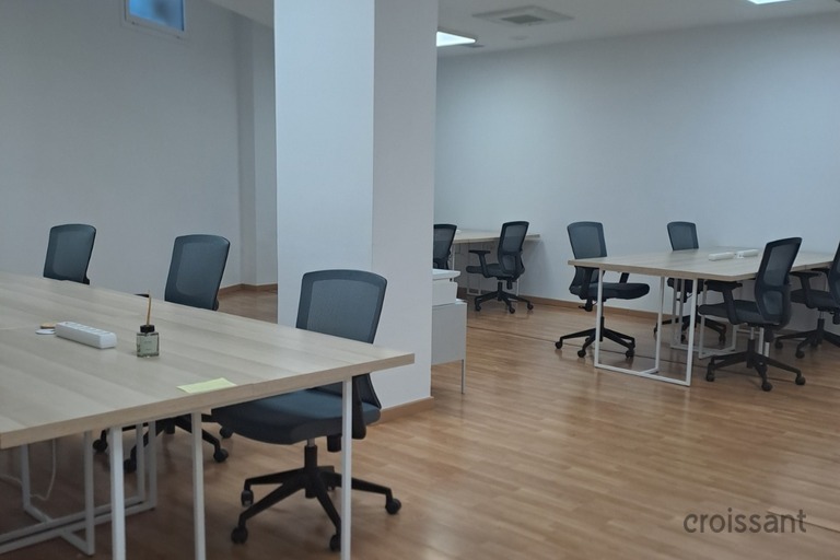 a living room filled with furniture on top of a hard wood floor