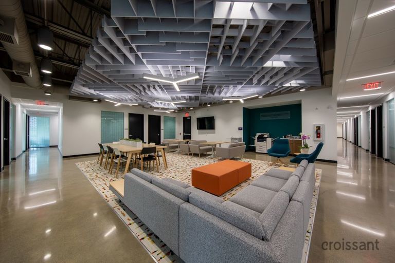 a room filled with furniture next to a building