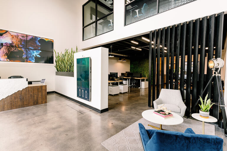 a room filled with furniture and a large window