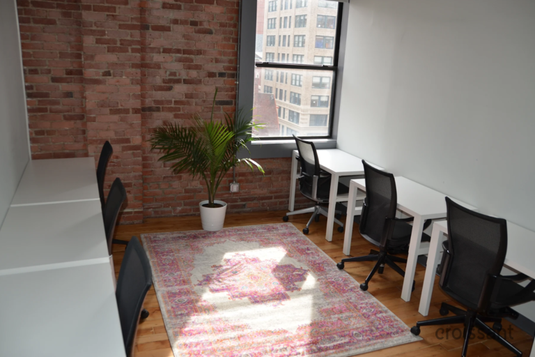 a dining room table in front of a window