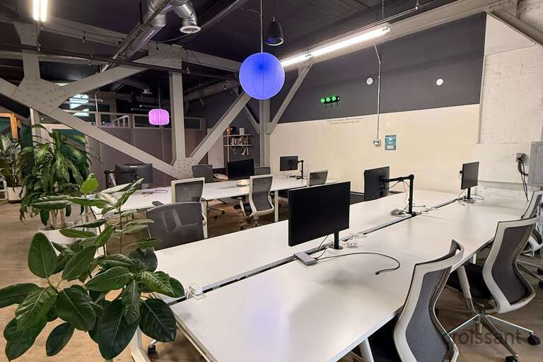 a group of people performing on stage in front of a building