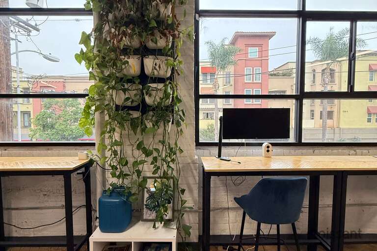 a room filled with furniture and a large window