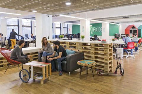 a group of people sitting at a table in a room