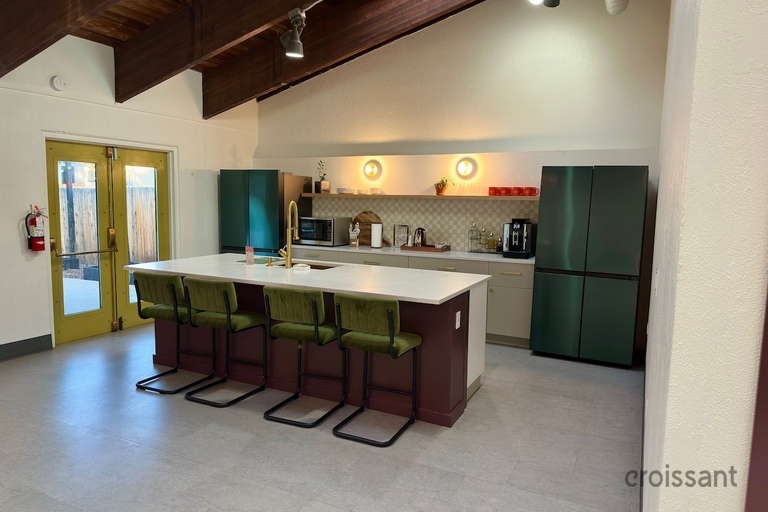 a kitchen with a table in a room