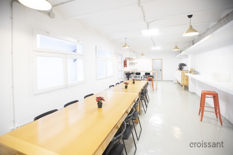 a kitchen with a table in a room