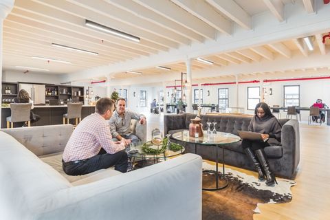 a group of people sitting at a table in a room