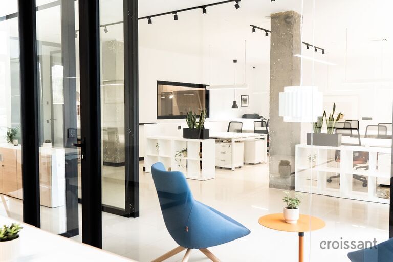 a room filled with furniture and a large window