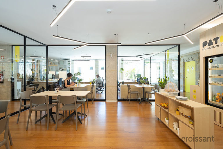 a room filled with furniture and a large window