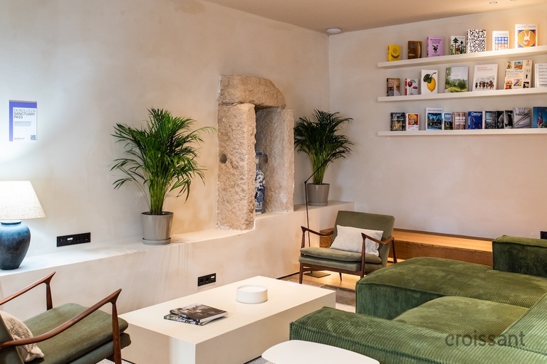 a living room filled with furniture and a large window