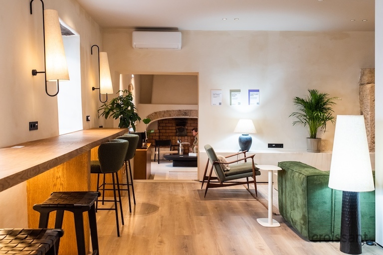 a living room filled with furniture and a fireplace