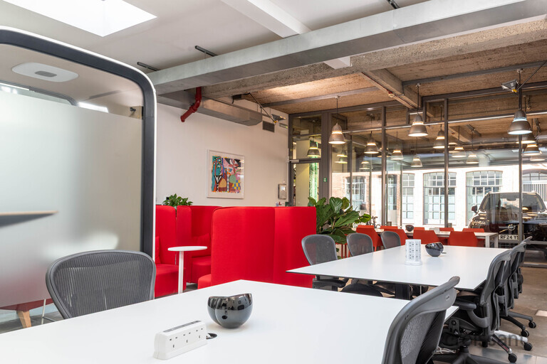 a train that is sitting on a chair in a room