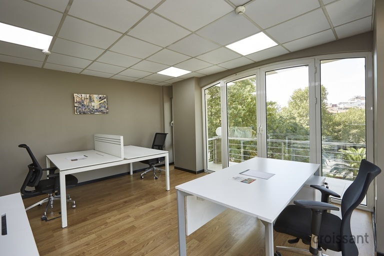 a dining room table in front of a window