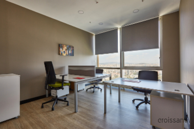 a room filled with furniture and a large window