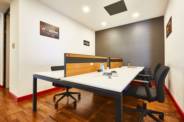 a desk with a chair in a room
