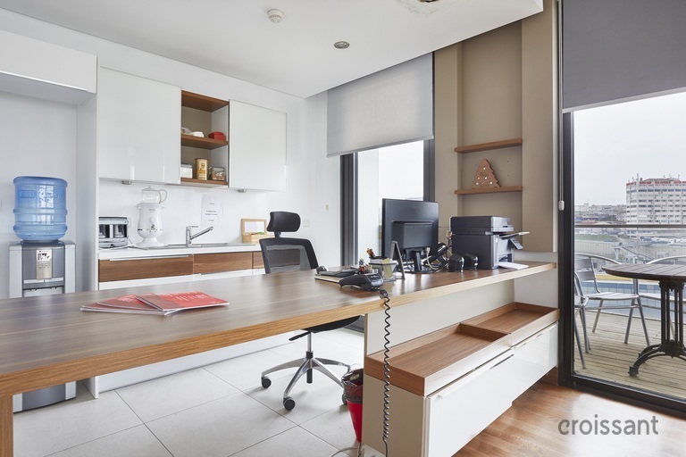 a kitchen with an island in the middle of a room