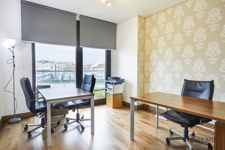 a bedroom with a desk and chair in a room