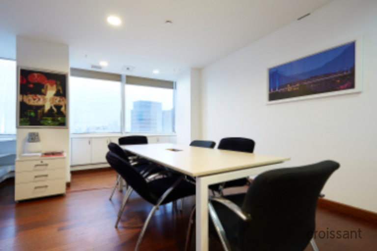 a living room filled with furniture and a flat screen tv