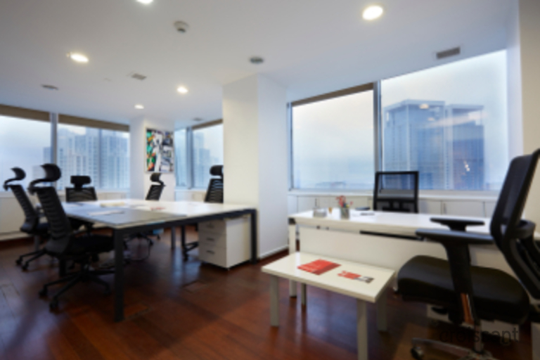 a living room filled with furniture and a flat screen tv