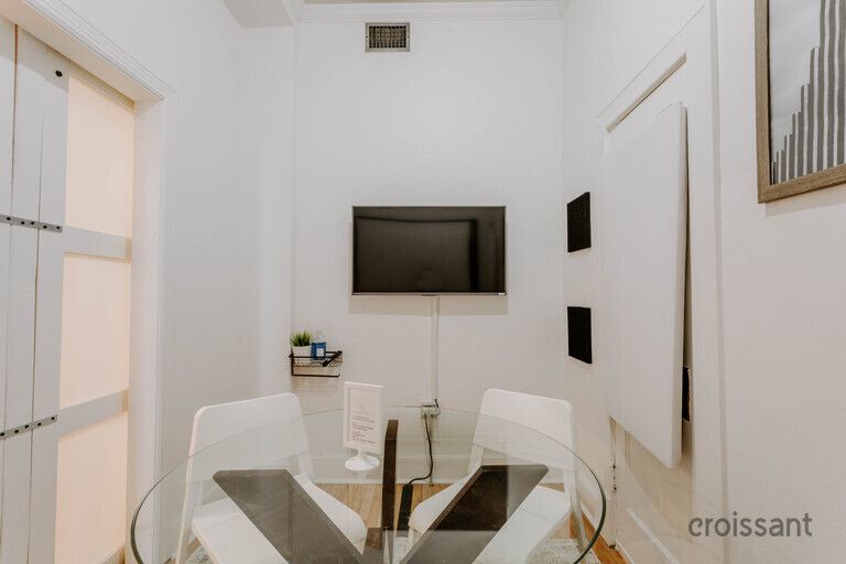a room with a sink and a mirror