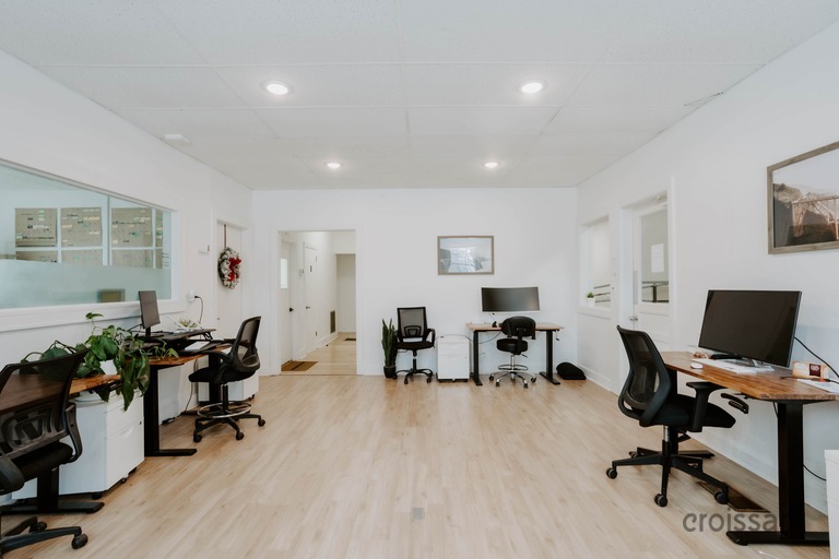 a living room filled with furniture on top of a hard wood floor
